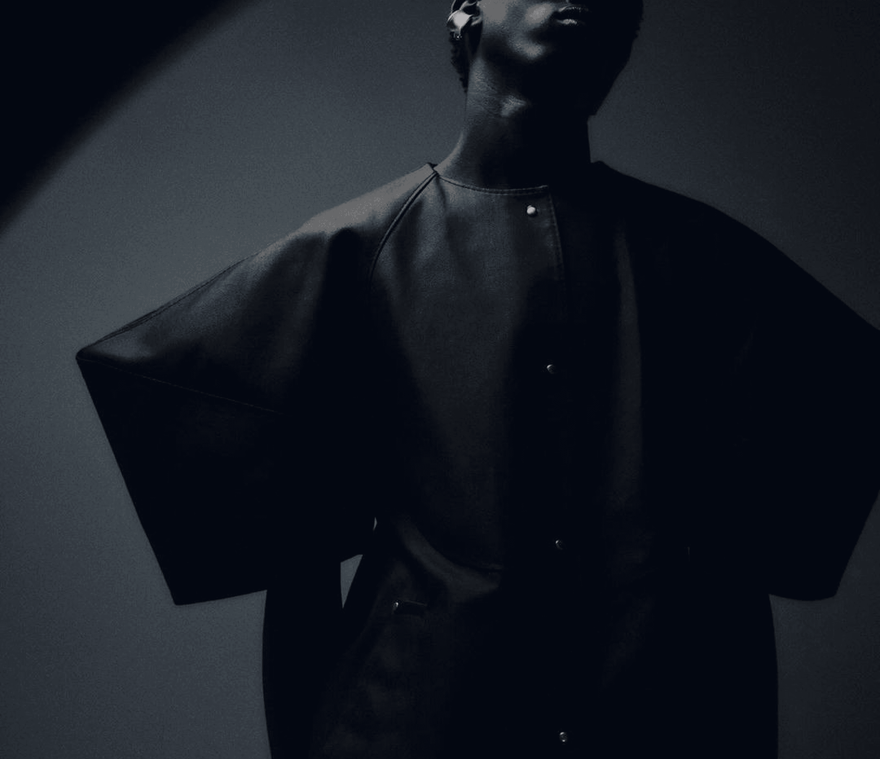 Fashion model in dark clothing