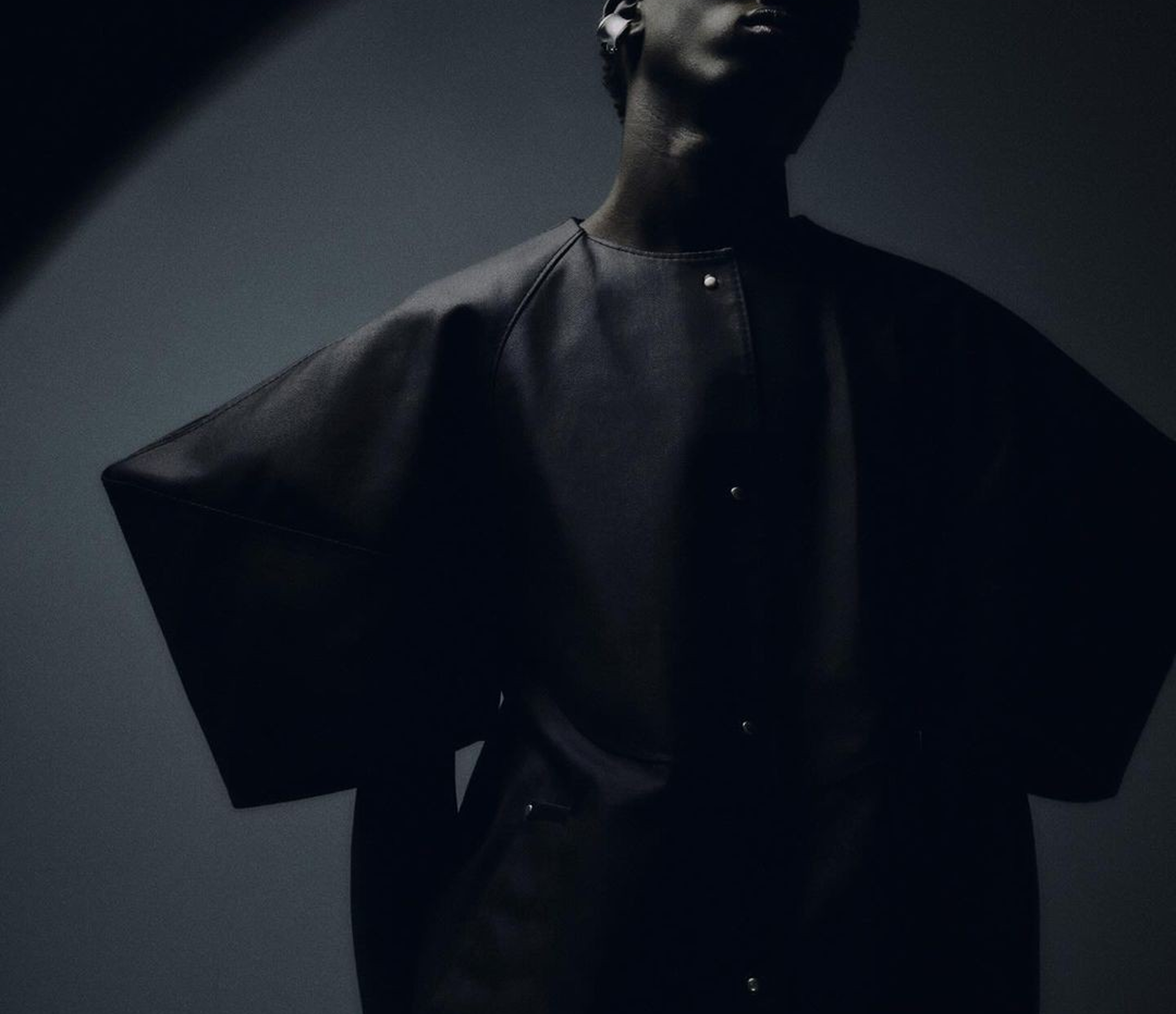Fashion model in dark clothing