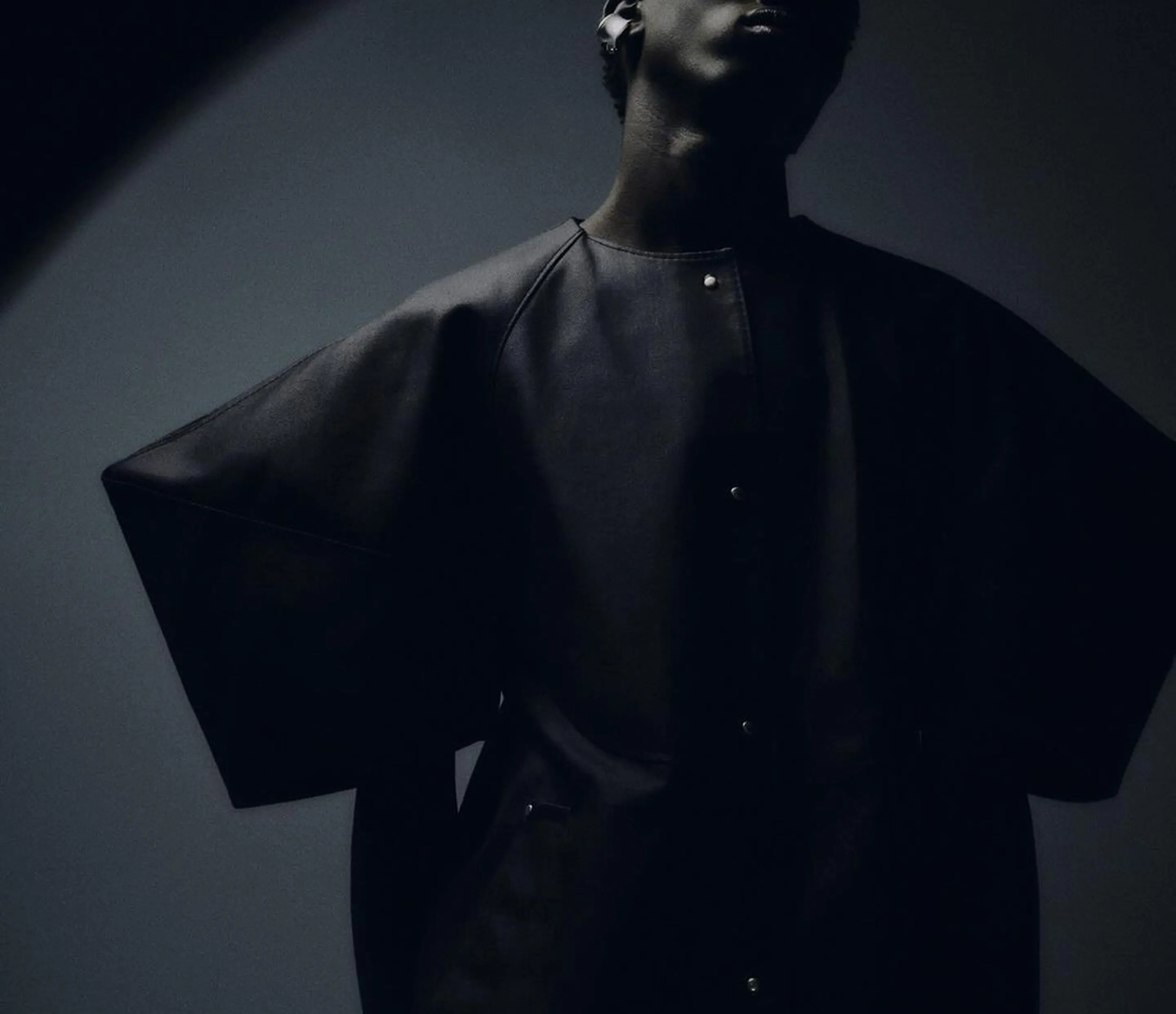 Fashion model in dark clothing